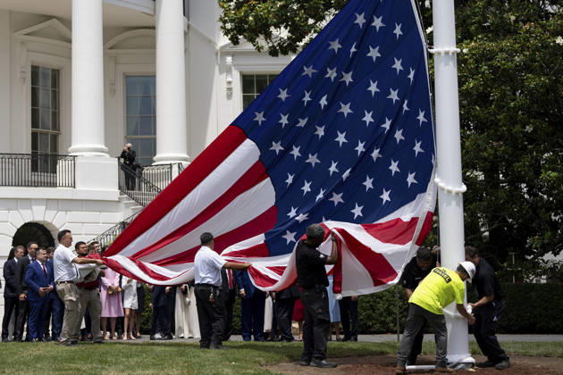 October 5, 2026, Washington, Dc, United States of America: An American flag is raised on a newly installed flagpole on the South Lawn of the White House as U.S. President Donald Trump, family members and guests look on, June 18, 2025 in Washington, D.C. The flag was raised on one of two new flagpoles Trump had installed on the North and South Lawns of the White House, which he said he paid for personally. Washington United States of America - ZUMAp138 20261005_zaa_p138_080 Copyright: xAndreaxHanks WhitexHousex