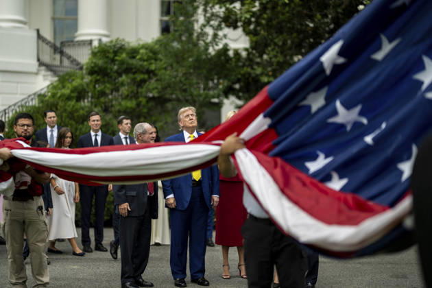 October 5, 2026, Washington, Dc, United States of America: U.S. President Donald Trump watches as workers unfurl an American flag to be raised on a newly installed flagpole on the South Lawn of the White House, June 18, 2025 in Washington, D.C. The flag was raised on one of two new flagpoles Trump had installed on the North and South Lawns of the White House, which he said he paid for personally. Washington United States of America - ZUMAp138 20261005_zaa_p138_042 Copyright: xDanielxTorok WhitexHousex