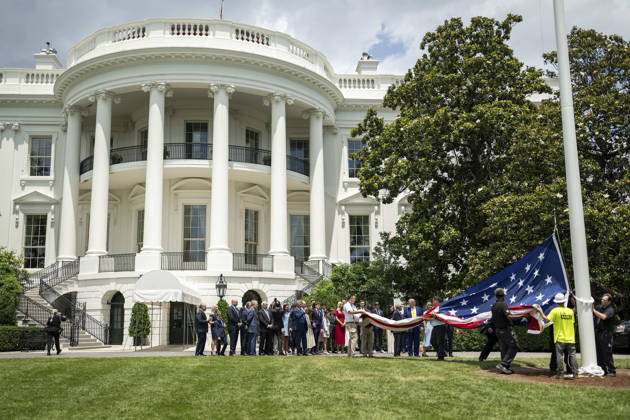 October 5, 2026, Washington, Dc, United States of America: An American flag is raised on a newly installed flagpole on the South Lawn of the White House as U.S. President Donald Trump, family members and guests look on, June 18, 2025 in Washington, D.C. The flag was raised on one of two new flagpoles Trump had installed on the North and South Lawns of the White House, which he said he paid for personally. Washington United States of America - ZUMAp138 20261005_zaa_p138_046 Copyright: xDanielxTorok WhitexHousex