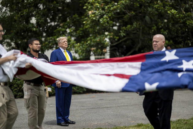 October 5, 2026, Washington, Dc, United States of America: U.S. President Donald Trump watches as workers unfurl an American flag to be raised on a newly installed flagpole on the South Lawn of the White House, June 18, 2025 in Washington, D.C. The flag was raised on one of two new flagpoles Trump had installed on the North and South Lawns of the White House, which he said he paid for personally. Washington United States of America - ZUMAp138 20261005_zaa_p138_043 Copyright: xDanielxTorok WhitexHousex