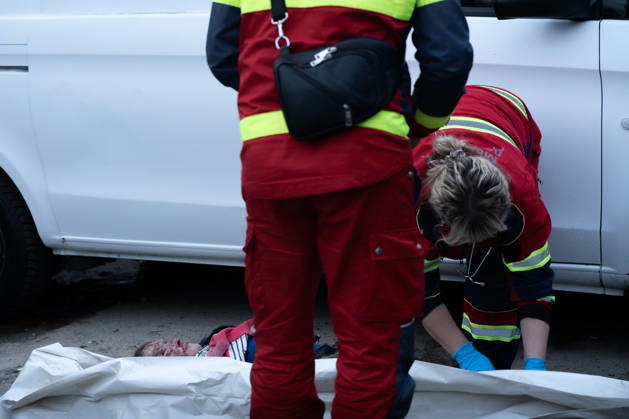 October 5, 2026, Kharkiv, Kharkiv Oblast, Ukraine: Local rescue workers identify the body of a woman following a Russian aerial attack on a bus repair warehouse in Kharkiv, Ukraine. Two people were killed in the attack, while emergency crews, firefighters and Red Cross volunteers worked to clear the rubble and search the damaged site. Kharkiv Ukraine - ZUMAm350 20261005_zip_m350_020 Copyright: xCameronxJones-Manleyx