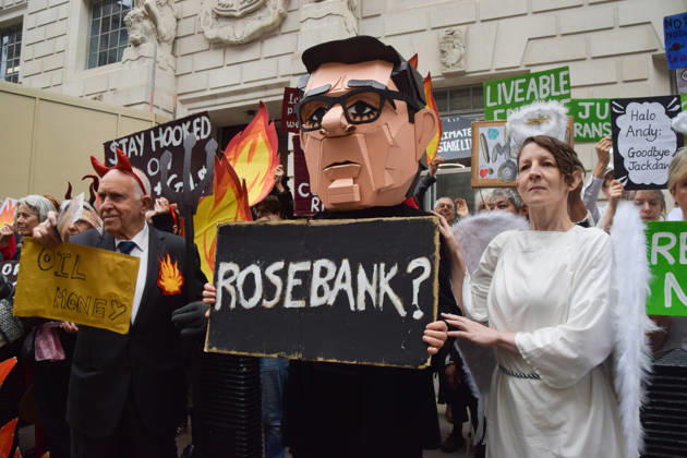 October 6, 2026, London, England, United Kingdom: Activists from the group Fossil Free London stage a protest against the Rosebank oil field and the Jackdaw gas field outside the Department for Energy Security and Net Zero. Activists dressed as angels urge a protester wearing an Andy Burnham mask to stop the fossil fuel projects in the North Sea while activists dressed as demons urge him to drill for more oil. London United Kingdom  - ZUMAv130 20261006_zip_v130_004 Copyright: xVukxValcicx