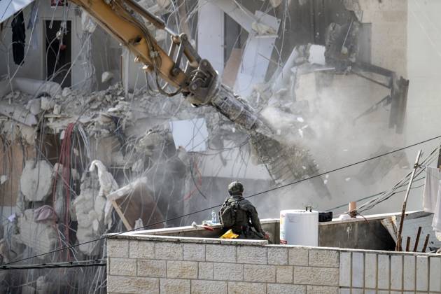 Israeli minister Ben-Gvir poses on bulldozer during demolition of Palestinian home in Jerusalem JERUSALEM - OCTOBER 06: Israeli far-right National Security Minister Itamar Ben-Gvir poses on a bulldozer after taking part in the demolition of a five-story building belonging to Palestinians in East Jerusalem on October 06, 2026. Israeli forces began demolishing the five-story building in the Tur neighborhood with bulldozers in the morning hours. Israeli forces took security measures in the area. Mostafa Alkharouf Anadolu Jerusalem Israel. Editorial use only. Please get in touch for any other usage.  Copyright: x2026xAnadoluxMostafaxAlkharoufx