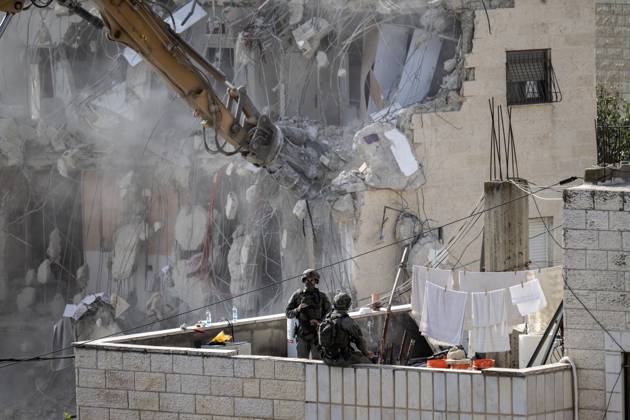 Israeli minister Ben-Gvir poses on bulldozer during demolition of Palestinian home in Jerusalem JERUSALEM - OCTOBER 06: Israeli far-right National Security Minister Itamar Ben-Gvir poses on a bulldozer after taking part in the demolition of a five-story building belonging to Palestinians in East Jerusalem on October 06, 2026. Israeli forces began demolishing the five-story building in the Tur neighborhood with bulldozers in the morning hours. Israeli forces took security measures in the area. Mostafa Alkharouf Anadolu Jerusalem Israel. Editorial use only. Please get in touch for any other usage.  Copyright: x2026xAnadoluxMostafaxAlkharoufx