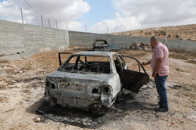 Palestinian Inspects Burned Vehicles Near al-Samu South of Hebron A Palestinian man inspects his burned vehicles near the town of al-Samu, south of Hebron, in the West Bank, on October 6, 2026, after an apparent arson attack believed to have been carried out by Israeli settlers. The incident comes amid an increase in settler attacks on Palestinians and their property in different areas of the West Bank. Photo by Mamoun Wazwaz apaimages Hebron West Bank Palestinian Territory 061026_Hebron_MW_00(1) Copyright: xapaimagesxMamounxWazwazx xapaimagesx