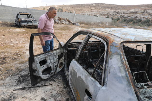 Palestinian Inspects Burned Vehicles Near al-Samu South of Hebron A Palestinian man inspects his burned vehicles near the town of al-Samu, south of Hebron, in the West Bank, on October 6, 2026, after an apparent arson attack believed to have been carried out by Israeli settlers. The incident comes amid an increase in settler attacks on Palestinians and their property in different areas of the West Bank. Photo by Mamoun Wazwaz apaimages Hebron West Bank Palestinian Territory 061026_Hebron_MW_00(3) Copyright: xapaimagesxMamounxWazwazx xapaimagesx