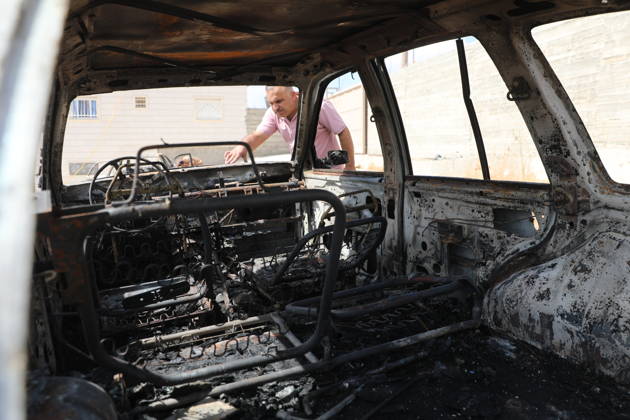 Palestinian Inspects Burned Vehicles Near al-Samu South of Hebron A Palestinian man inspects his burned vehicles near the town of al-Samu, south of Hebron, in the West Bank, on October 6, 2026, after an apparent arson attack believed to have been carried out by Israeli settlers. The incident comes amid an increase in settler attacks on Palestinians and their property in different areas of the West Bank. Photo by Mamoun Wazwaz apaimages Hebron West Bank Palestinian Territory 061026_Hebron_MW_00(9) Copyright: xapaimagesxMamounxWazwazx xapaimagesx
