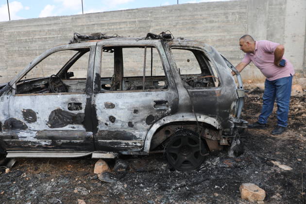 Palestinian Inspects Burned Vehicles Near al-Samu South of Hebron A Palestinian man inspects his burned vehicles near the town of al-Samu, south of Hebron, in the West Bank, on October 6, 2026, after an apparent arson attack believed to have been carried out by Israeli settlers. The incident comes amid an increase in settler attacks on Palestinians and their property in different areas of the West Bank. Photo by Mamoun Wazwaz apaimages Hebron West Bank Palestinian Territory 061026_Hebron_MW_00(7) Copyright: xapaimagesxMamounxWazwazx xapaimagesx