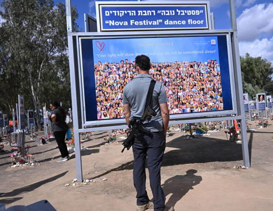 People look at photos of hundreds of victims killed by Hamas on October 7, 2023, at the Nova Festival Memorial site in Re im, near the Gaza border on Monday, October 6, 2026. Israel is marking three years since the Hamas attack that killed 1,200 people and 251 were taken hostage into Gaza.  JER2026100602 DEBBIExHILL