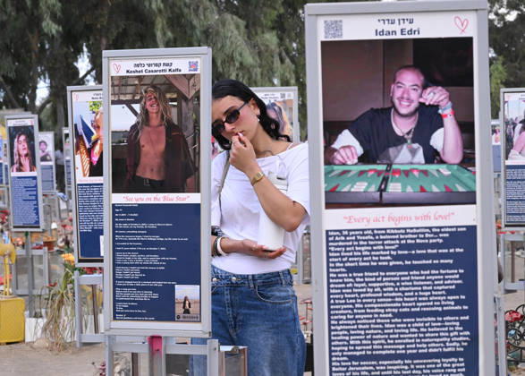 A woman mourns near a photo of a victim killed by Hamas on October 7, 2023, at the Nova Festival Memorial site in Re im, near the Gaza border on Monday, October 6, 2026. Israel is marking three years since the Hamas attack that killed 1,200 people and 251 were taken hostage into Gaza.  JER2026100615 DEBBIExHILL