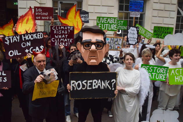 October 6, 2026, London, England, United Kingdom: Activists from the group Fossil Free London stage a protest against the Rosebank oil field and the Jackdaw gas field outside the Department for Energy Security and Net Zero. Activists dressed as angels urge a protester wearing an Andy Burnham mask to stop the fossil fuel projects in the North Sea while activists dressed as devils urge him to drill for more oil. London United Kingdom  - ZUMAv130 20261006_zip_v130_049 Copyright: xVukxValcicx