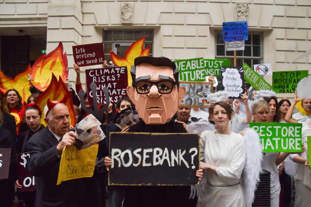 October 6, 2026, London, England, United Kingdom: Activists from the group Fossil Free London stage a protest against the Rosebank oil field and the Jackdaw gas field outside the Department for Energy Security and Net Zero. Activists dressed as angels urge a protester wearing an Andy Burnham mask to stop the fossil fuel projects in the North Sea while activists dressed as devils urge him to drill for more oil. London United Kingdom  - ZUMAv130 20261006_zip_v130_051 Copyright: xVukxValcicx
