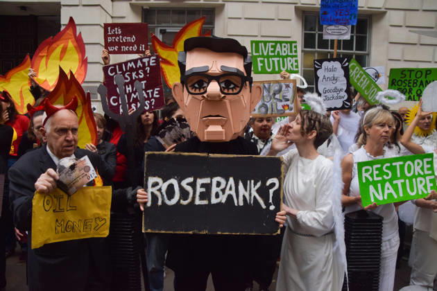 October 6, 2026, London, England, United Kingdom: Activists from the group Fossil Free London stage a protest against the Rosebank oil field and the Jackdaw gas field outside the Department for Energy Security and Net Zero. Activists dressed as angels urge a protester wearing an Andy Burnham mask to stop the fossil fuel projects in the North Sea while activists dressed as devils urge him to drill for more oil. London United Kingdom  - ZUMAv130 20261006_zip_v130_052 Copyright: xVukxValcicx