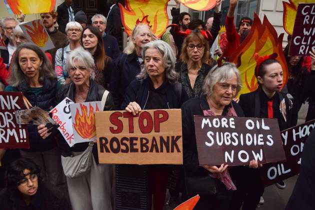 October 6, 2026, London, England, United Kingdom: Activists from the group Fossil Free London stage a protest against the Rosebank oil field and the Jackdaw gas field outside the Department for Energy Security and Net Zero. Activists dressed as angels urge a protester wearing an Andy Burnham mask to stop the fossil fuel projects in the North Sea while activists dressed as devils urge him to drill for more oil. London United Kingdom  - ZUMAv130 20261006_zip_v130_055 Copyright: xVukxValcicx