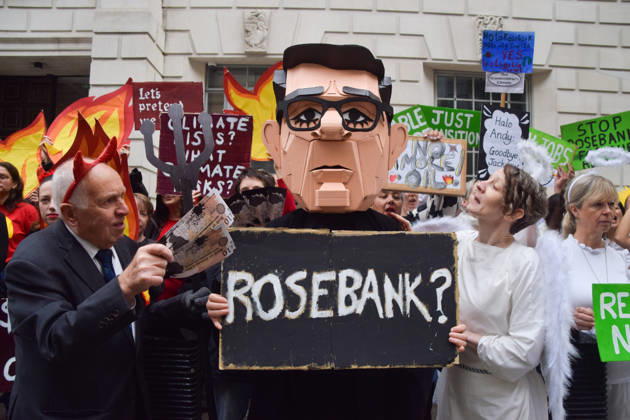 October 6, 2026, London, England, United Kingdom: Activists from the group Fossil Free London stage a protest against the Rosebank oil field and the Jackdaw gas field outside the Department for Energy Security and Net Zero. Activists dressed as angels urge a protester wearing an Andy Burnham mask to stop the fossil fuel projects in the North Sea while activists dressed as devils urge him to drill for more oil. London United Kingdom  - ZUMAv130 20261006_zip_v130_056 Copyright: xVukxValcicx
