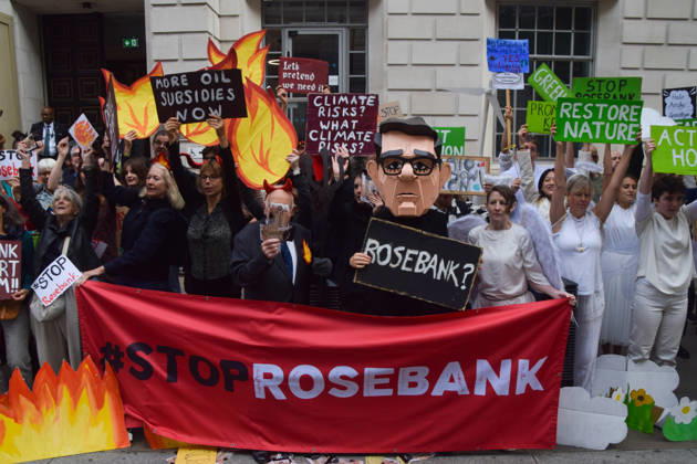 October 6, 2026, London, England, United Kingdom: Activists from the group Fossil Free London stage a protest against the Rosebank oil field and the Jackdaw gas field outside the Department for Energy Security and Net Zero. Activists dressed as angels urge a protester wearing an Andy Burnham mask to stop the fossil fuel projects in the North Sea while activists dressed as devils urge him to drill for more oil. London United Kingdom  - ZUMAv130 20261006_zip_v130_059 Copyright: xVukxValcicx