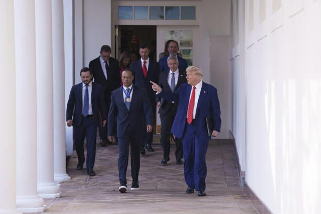 October 6, 2026, Washington, Dc, United States of America: U.S. President Donald Trump walks with golfer Tiger Woods along the West Colonnade of the White House before a reception honoring Black History Month, February 20, 2025 in Washington, D.C. Woods, who received the Presidential Medal of Freedom from Trump in 2019, joined PGA Tour leaders at the White House for talks on a proposed deal with Saudi ArabiaÃ¢â‚¬â ¢s Public Investment Fund before Trump introduced him as a surprise guest at a Black History Month reception. Washington United States of America - ZUMAp138 20261006_zaa_p138_006 Copyright: xJoycexBoghosian WhitexHousex