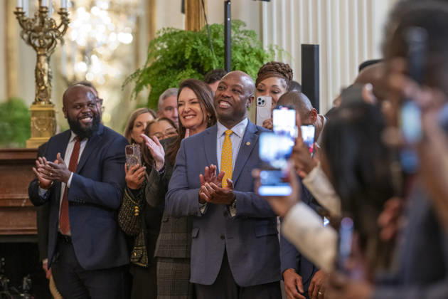 October 6, 2026, Washington, Dc, United States: U.S Senator Tim Scott, R-SC, center, and Secretary of Agriculture Brooke Rollins, left, applaud President Donald Trump during a Black History Month event at the East Room of the White House, February 20, 2025 in Washington, D.C. Washington United States - ZUMAp138 20261006_zaa_p138_020 Copyright: xMollyxRiley WhitexHousex