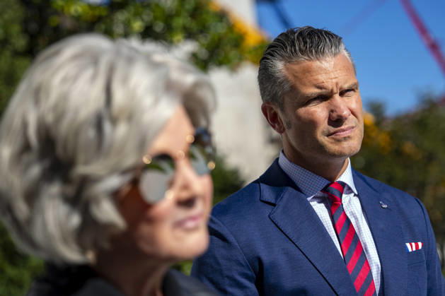 Secretary of Defense Pete Hegseth and White House Chief of Staff Susie Wiles look on as President Donald Trump speaks with reporters before boarding Marine One on the South Lawn of the White House in Washington, DC on Tuesday, October 6, 2026. The President is going to Baltimore, Maryland to deliver remarks at Anduril Industries, a tech company that builds robotic weapons and software for the military.  WAP20261006303 BONNIExCASH