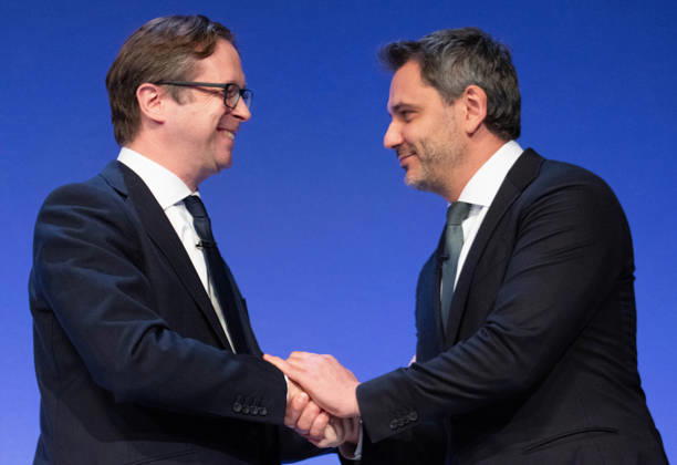 October 6, 2026, Birmingham, United Kingdom: Alex Burghart Shadow Secretary of State for Northern Ireland greets Yehor Cherniev, Ukrainian MP. The session Defending Britain in a More Dangerous World took place on the main stage at the Conservative Party Conference at the ICC Birmingham. It featured key shadow cabinet figures including Tom Tugendhat, Helen Whately , James Cartlidge, and Alex Burghart , as well as a performance by St Mary s Ukrainian School choir. They were also joined by Yehor Cherniev, Ukrainian MP and Professor Niall Ferguson Birmingham United Kingdom - ZUMAs197 20261006_aaa_s197_107 Copyright: xGaryxRobertsx
