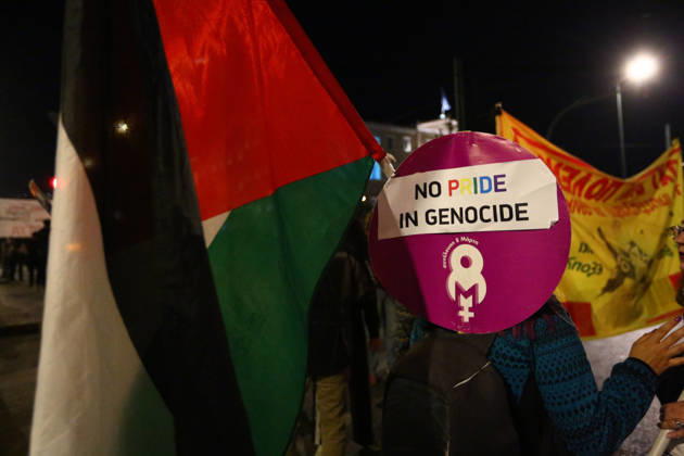 October 6, 2026, Athens, Attica, GREECE: A protester holds a Ã¢â‚¬oeNO PRIDE IN GENOCIDEÃ¢â‚¬Â placard beside a Palestinian flag during an anti-war demonstration opposing the visit of US Secretary of State MARCO RUBIO. Athens GREECE - ZUMAx103 20261006_zip_x103_019 Copyright: xHarrisxXanthopoulosx