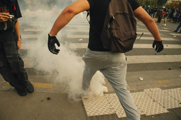 Paris Students Protest Education Conditions A demonstrator runs past a smoking tear gas canister on the pavement in Paris, France, on October 6, 2026. France s Interior Ministry said 256,000 people marched nationwide, including 56,000 in Paris, during the student-led day of action over school conditions. High school students called for more education funding and staff, smaller classes and improved facilities, with teachers, parents and unions joining demonstrations. Paris Ile de France France Copyright: xDavoodxMaeilix
