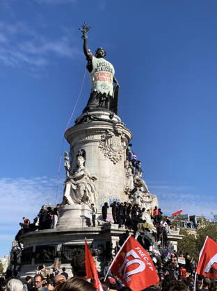 The statue of Marianne, symbol of the French Republic, is clad with a makeshift cloth as high school students demonstrate in the streets of Paris on Tuesday, October 6, 2026. Hundreds of thousands of students and their supporters took part in nationwide protests across France today to protest school conditions.  PAR20261006101 MAYAxVIDON-WHITE