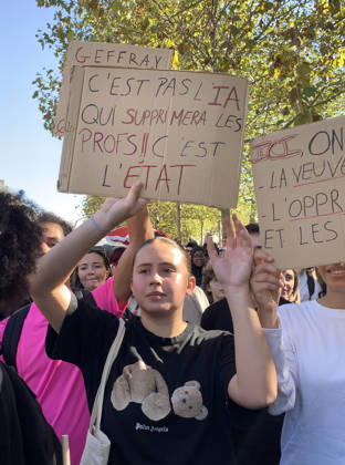 High school students hold placards as they demonstrate in the streets of Paris on Tuesday, October 6, 2026. Hundreds of thousands of students and their supporters took part in nationwide protests across France today to protest school conditions.  PAR20261006108 MAYAxVIDON-WHITE
