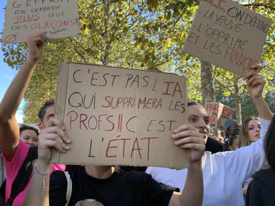 High school students hold placards as they demonstrate in the streets of Paris on Tuesday, October 6, 2026. Hundreds of thousands of students and their supporters took part in nationwide protests across France today to protest school conditions.  PAR20261006109 MAYAxVIDON-WHITE