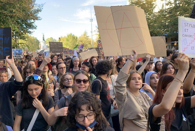 High school students hold placards as they demonstrate in the streets of Paris on Tuesday, October 6, 2026. Hundreds of thousands of students and their supporters took part in nationwide protests across France today to protest school conditions.  PAR20261006114 MAYAxVIDON-WHITE