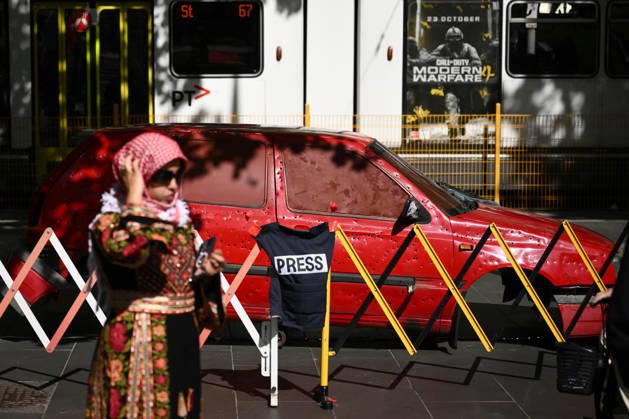 PRO-PALESTINE VIGIL, An installation featuring a replica bullet-riddled car as pro-Palestine protestors hold a vigil for Gaza at the State Library Victoria in Melbourne, Wednesday, October 7, 2026. ( NO ARCHIVING MELBOURNE VICTORIA Australia  Copyright: xJOELxCARRETTx 20261007191518484364