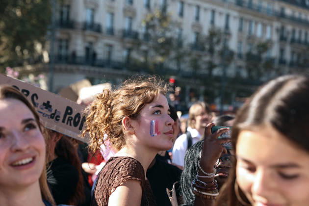 High School And University Student Protest - Paris A student with the French flag painted on her cheek stands at Place de la Republique during a nationwide youth demonstration. Nationwide mobilization by high school and university students calling for better teaching and study conditions, increased funding and staffing, an end to overcrowded classrooms and deteriorating infrastructure, and improved access to education, amidst concerns over social inequalities and student financial insecurity in Paris, France, October 6, 2026. Photo by Christophe Michel ABACAPRESS.COM Paris ILE DE FRANCE France  Copyright: xMichelxChristophe ABACAx