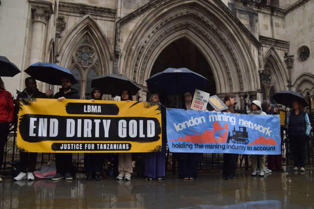 October 7, 2026, London, England, United Kingdom: Campaigners stand outside the Royal Courts of Justice as the legal case against the London Bullion Market Association begins. The LBMA is accused of incorrectly certifying gold from TanzaniaÃ¢â‚¬â ¢s North Mara mine as clean , despite reported human rights abuses connected to the mine. The case is being brought by the families of two Tanzanian men who were killed at the gold mine. London United Kingdom - ZUMAv130 20261007_zip_v130_005 Copyright: xVukxValcicx