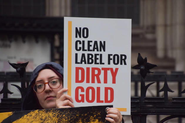 October 7, 2026, London, England, United Kingdom: Campaigners stand outside the Royal Courts of Justice as the legal case against the London Bullion Market Association begins. The LBMA is accused of incorrectly certifying gold from TanzaniaÃ¢â‚¬â ¢s North Mara mine as clean , despite reported human rights abuses connected to the mine. The case is being brought by the families of two Tanzanian men who were killed at the gold mine. London United Kingdom - ZUMAv130 20261007_zip_v130_011 Copyright: xVukxValcicx