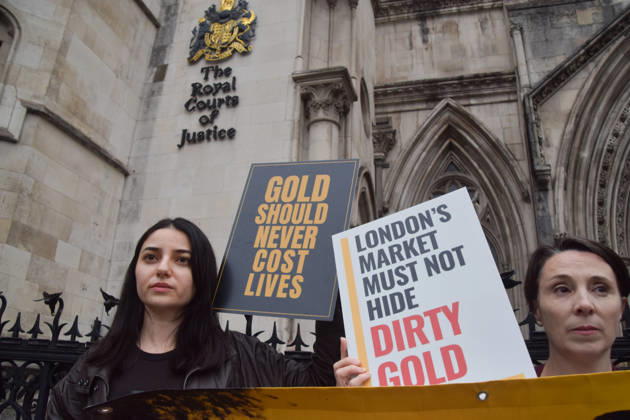 October 7, 2026, London, England, United Kingdom: Campaigners stand outside the Royal Courts of Justice as the legal case against the London Bullion Market Association begins. The LBMA is accused of incorrectly certifying gold from TanzaniaÃ¢â‚¬â ¢s North Mara mine as clean , despite reported human rights abuses connected to the mine. The case is being brought by the families of two Tanzanian men who were killed at the gold mine. London United Kingdom - ZUMAv130 20261007_zip_v130_012 Copyright: xVukxValcicx