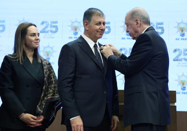 Legislative Year Opening Meeting with AK Party Deputies ANKARA, TURKIYE - OCTOBER 7: (----EDITORIAL USE ONLY - MANDATORY CREDIT - TURKISH PRESIDENCY MUSTAFA KAMACI HANDOUT - NO MARKETING NO ADVERTISING CAMPAIGNS - DISTRIBUTED AS A SERVICE TO CLIENTS----) Turkish President and Leader of the Justice and Development (AK) Party Recep Tayyip Erdogan (R) pins the party badge on Izmir Metropolitan Municipality Mayor Cemil Tugay (C), who joined the AK Party, as Tugay s wife Oznur Tugay (L) looks on during the Legislative Year Opening Meeting with AK Party Deputies at the AK Party Congress Center in Ankara, Turkiye on October 7, 2026. Turkish Presidency Mustafa Kamaci Handout Anadolu Ankara Turkey. Editorial use only. Please get in touch  Copyright: x2026xAnadoluxTurkishxPresidencyx xMustafaxKamacix xHandoutx