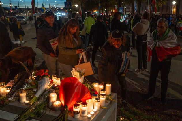October 7, 2026, Stockholm, Stockholm County, Sweden: STOCKHOLM, SWEDEN - OCTOBER 7, 2026: People gather outside the Israeli Embassy in Stockholm to show support for Israel and remember the victims of the October 7 attacks. Participants place flowers and light candles at a memorial as Israeli and Iranian flags are displayed during the gathering Stockholm Sweden - ZUMAa136 20261007_zap_a136_007 Copyright: xJoelxLindhex
