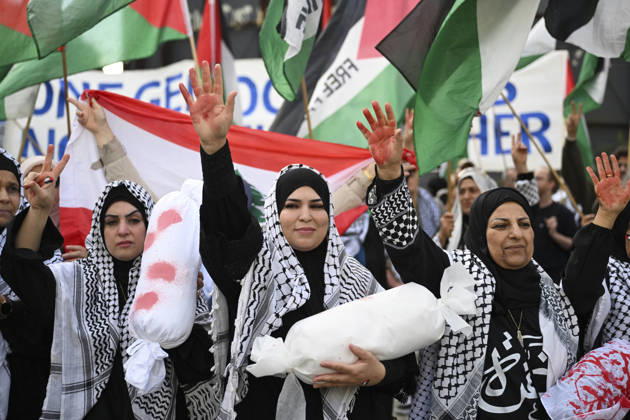 Police in Berlin intervened in demonstrations in support of Palestinians BERLIN, GERMANY - OCTOBER 7: Demonstrators hold toy dolls wrapped in white shrouds to symbolize Palestinian children killed in Israeli attacks, during a pro-Palestine rally organized by Palestinian associations at the intersection of Zimmer and Friedrich streets in Berlin, Germany on October 7, 2026. Halil Sagirkaya Anadolu Berlin Germany. Editorial use only. Please get in touch for any other usage.  Copyright: x2026xAnadoluxHalilxSagirkayax