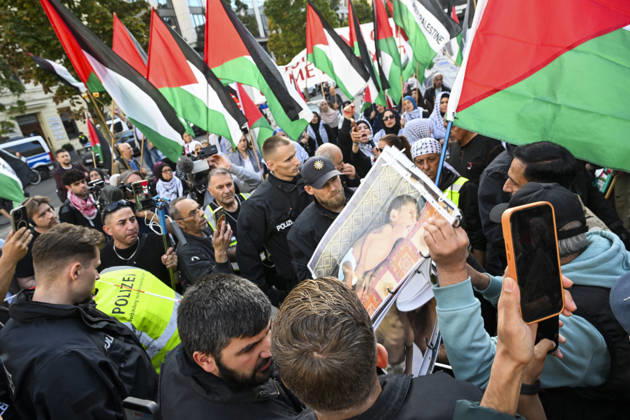 Police in Berlin intervened in demonstrations in support of Palestinians BERLIN, GERMANY - OCTOBER 7: Police officers intervene against a demonstrator carrying photos of Palestinian children killed by Israel in Gaza during a pro-Palestine rally organized by Palestinian associations at the intersection of Zimmer and Friedrich streets in Berlin, Germany on October 7, 2026. Protesters also carried toy dolls wrapped in white shrouds to symbolize the children who lost their lives in Israeli attacks. Halil Sagirkaya Anadolu Berlin Germany. Editorial use only. Please get in touch for any other usage.  Copyright: x2026xAnadoluxHalilxSagirkayax