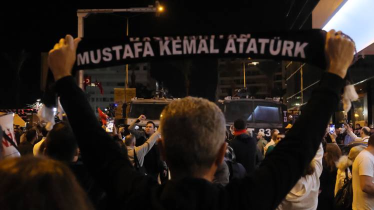 October 7, 2026, °Zmir, To¼rkiye: IZMIR, TURKEY, OCTOBER 7, 2026: Supporters of the opposition YENI Parti protest after Izmir Metropolitan Mayor Cemil Tugay joined President Recep Tayyip Erdogan s ruling AKP. Tugay was elected mayor as a CHP candidate in the 2024 local elections before leaving the party earlier this year. Protesters attempted to march toward Izmir City Hall carrying a black wreath, black carnations and a symbolic coffin while chanting for Tugay to resign. Police blocked parts of the march with barricades, riot police and water cannon vehicles, with protesters leaving flowers and the wreath near police barriers. °Zmir Türkiye - ZUMAq101 20261007_zna_q101_312 Copyright: xTurgayxKilicx