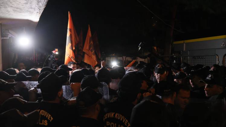 October 7, 2026, °Zmir, To¼rkiye: IZMIR, TURKEY, OCTOBER 7, 2026: Supporters of the opposition YENI Parti protest after Izmir Metropolitan Mayor Cemil Tugay joined President Recep Tayyip Erdogan s ruling AKP. Tugay was elected mayor as a CHP candidate in the 2024 local elections before leaving the party earlier this year. Protesters attempted to march toward Izmir City Hall carrying a black wreath, black carnations and a symbolic coffin while chanting for Tugay to resign. Police blocked parts of the march with barricades, riot police and water cannon vehicles, with protesters leaving flowers and the wreath near police barriers. °Zmir Türkiye - ZUMAq101 20261007_zna_q101_317 Copyright: xTurgayxKilicx