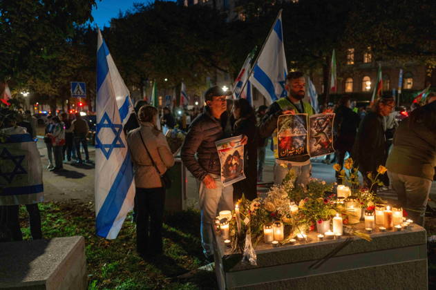 October 7, 2026, Stockholm, Stockholm County, Sweden: STOCKHOLM, SWEDEN - OCTOBER 7, 2026: People gather outside the Israeli Embassy in Stockholm to show support for Israel and remember the victims of the October 7 attacks. Participants place flowers and light candles at a memorial as Israeli and Iranian flags are displayed during the gathering Stockholm Sweden  - ZUMAa136 20261007_zap_a136_008 Copyright: xJoelxLindhex