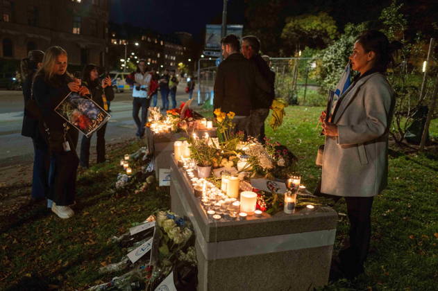 October 7, 2026, Stockholm, Stockholm County, Sweden: STOCKHOLM, SWEDEN - OCTOBER 7, 2026: People gather outside the Israeli Embassy in Stockholm to show support for Israel and remember the victims of the October 7 attacks. Participants place flowers and light candles at a memorial as Israeli and Iranian flags are displayed during the gathering Stockholm Sweden  - ZUMAa136 20261007_zap_a136_012 Copyright: xJoelxLindhex