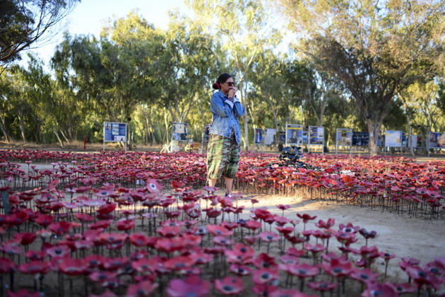Reim Nova Memorial Marks Anniversary A visitor stands among rows of red memorial flower markers at the Nova music festival memorial site near Reim, southern Israel, on October 7, 2026. The Hamas-led attack on Israel on October 7, 2023, killed about 1,200 people and saw 251 taken hostage; more than 350 people were killed at the Nova festival. Memorial events marking the third anniversary were held at the site throughout the day. Reim Southern District Israel Copyright: xTomerxNeubergx