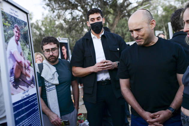 Reim Nova Memorial Marks Anniversary Former Israeli prime minister Naftali Bennett stands with visitors while looking at a memorial portrait plaque at the Nova music festival memorial site near Reim, southern Israel, on October 7, 2026. The Hamas-led attack on Israel on October 7, 2023, killed about 1,200 people and saw 251 taken hostage; more than 350 people were killed at the Nova festival. Memorial events marking the third anniversary were held at the site throughout the day. Reim Southern District Israel Copyright: xTomerxNeubergx