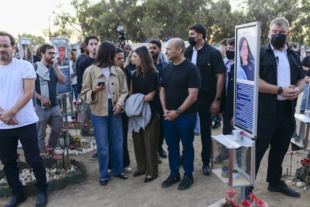 Reim Nova Memorial Marks Anniversary Visitors stand together between memorial portrait plaques at the Nova music festival memorial site near Reim, southern Israel, on October 7, 2026. The Hamas-led attack on Israel on October 7, 2023, killed about 1,200 people and saw 251 taken hostage; more than 350 people were killed at the Nova festival. Memorial events marking the third anniversary were held at the site throughout the day. Reim Southern District Israel Copyright: xTomerxNeubergx