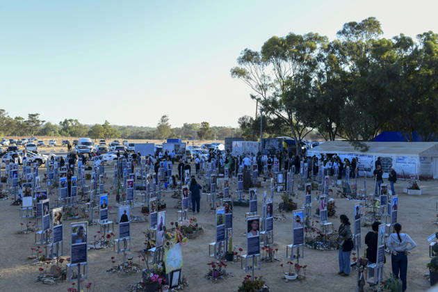 Reim Nova Memorial Marks Anniversary Visitors walk among rows of memorial portrait plaques and floral tributes at the Nova music festival memorial site near Reim, southern Israel, on October 7, 2026. The Hamas-led attack on Israel on October 7, 2023, killed about 1,200 people and saw 251 taken hostage; more than 350 people were killed at the Nova festival. Memorial events marking the third anniversary were held at the site throughout the day. Reim Southern District Israel Copyright: xTomerxNeubergx