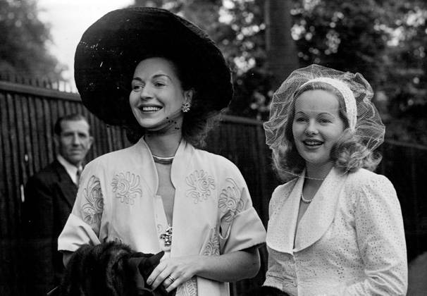 Gold Cup Day At Ascot -- Miss Greta Gynt wearing straw hat, and Miss Peggy Cummings, all in white, two welknown actresses on arrival at Ascot. June 14, 1951. (Photo by Fox Photos)  Copyright: xFoxxPhotosxLtd.x 5513-78877766