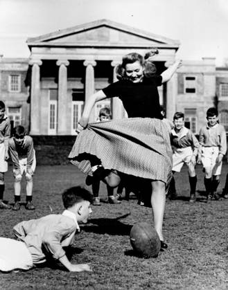Greta Gynt finds that her New Look allows for plenty of freedom of movement as she kicks at goal to declare the match open at Mill Hill School to-day (Thursday). The final scenes for the Two cities production of Hugh Walpole s story. Mr. Perrin and Mr. Traill