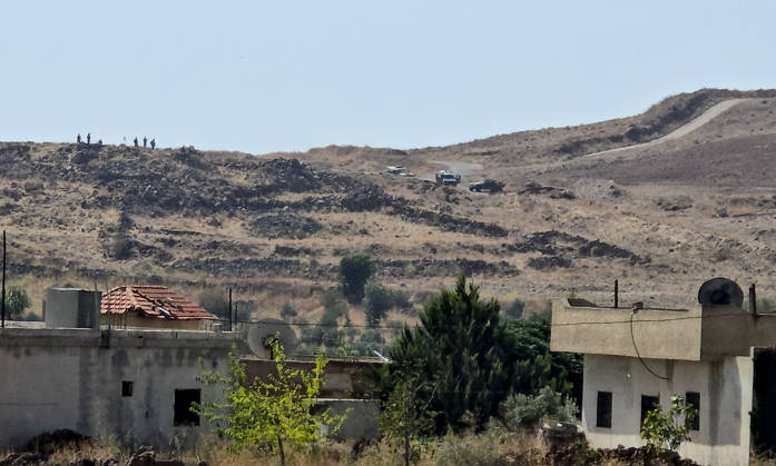 Israeli army conducts raids in Syria s Quneitra countryside QUNEITRA, SYRIA - OCTOBER 8: Israeli forces patrol the village as they conduct raids in residential areas and fire harassment shots at open areas in the countryside of Quneitra, southern Syria, on October 8, 2026. Huseyin Mesal Anadolu Quneitra Syria. Editorial use only. Please get in touch for any other usage.  Copyright: x2026xAnadoluxHuseyinxMesalx